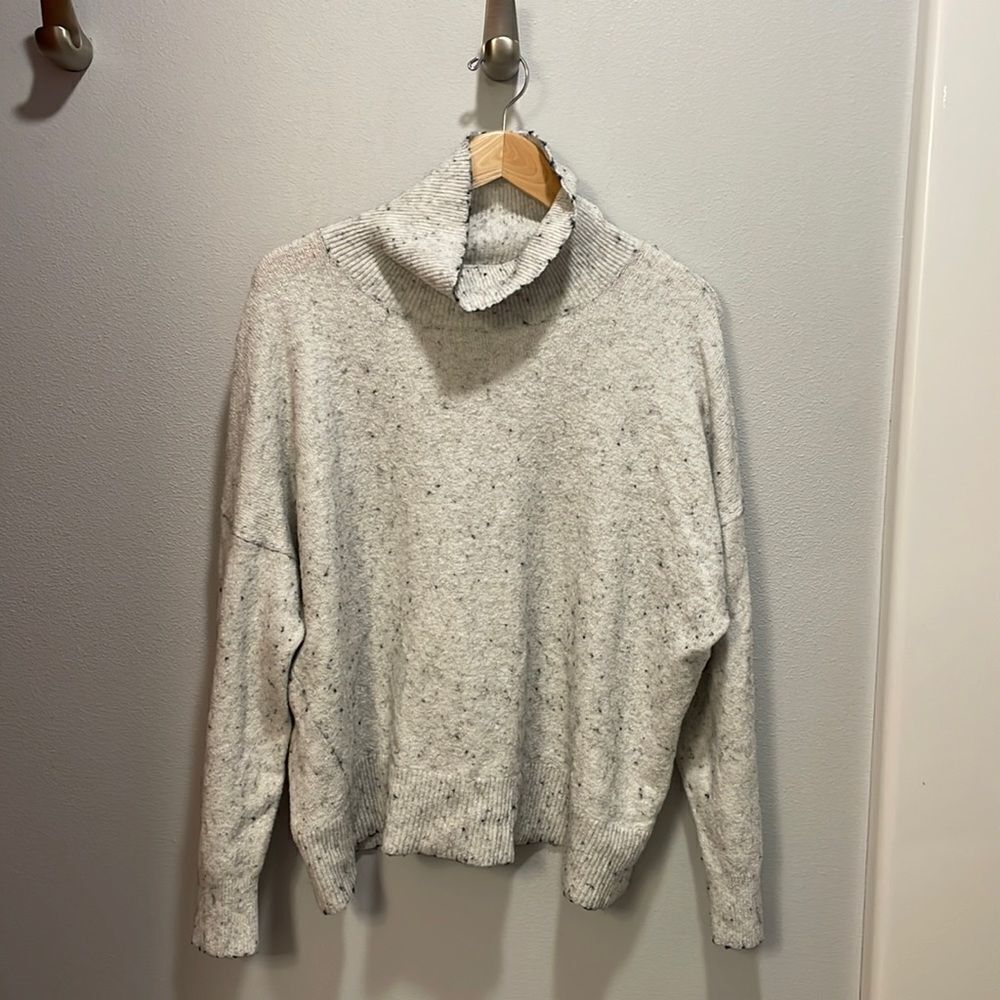 Treasure and Bond white turtleneck sweater with black spots all over it